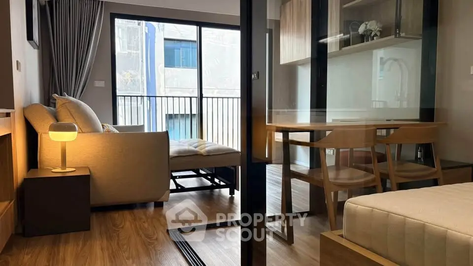 Modern apartment interior with cozy living room and dining area, featuring stylish furniture and natural light.