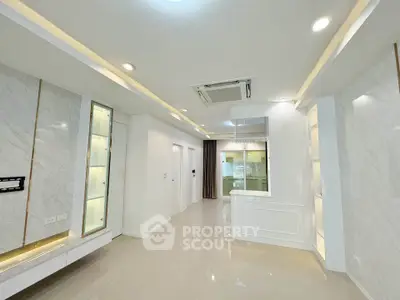 Modern living room with sleek design and built-in lighting features