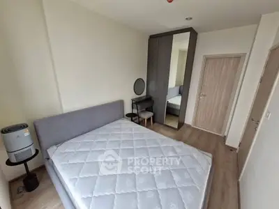 Modern bedroom with stylish furniture and ample natural light