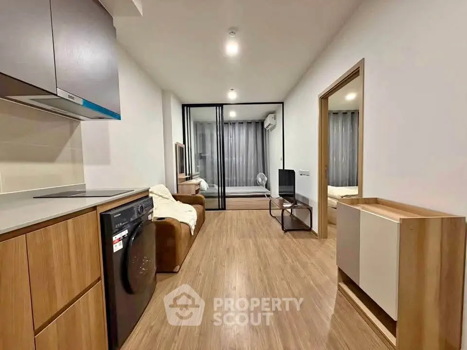 Modern apartment interior with open layout and wooden flooring