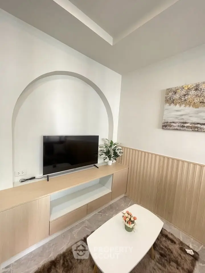 Modern living room with stylish TV unit and elegant decor