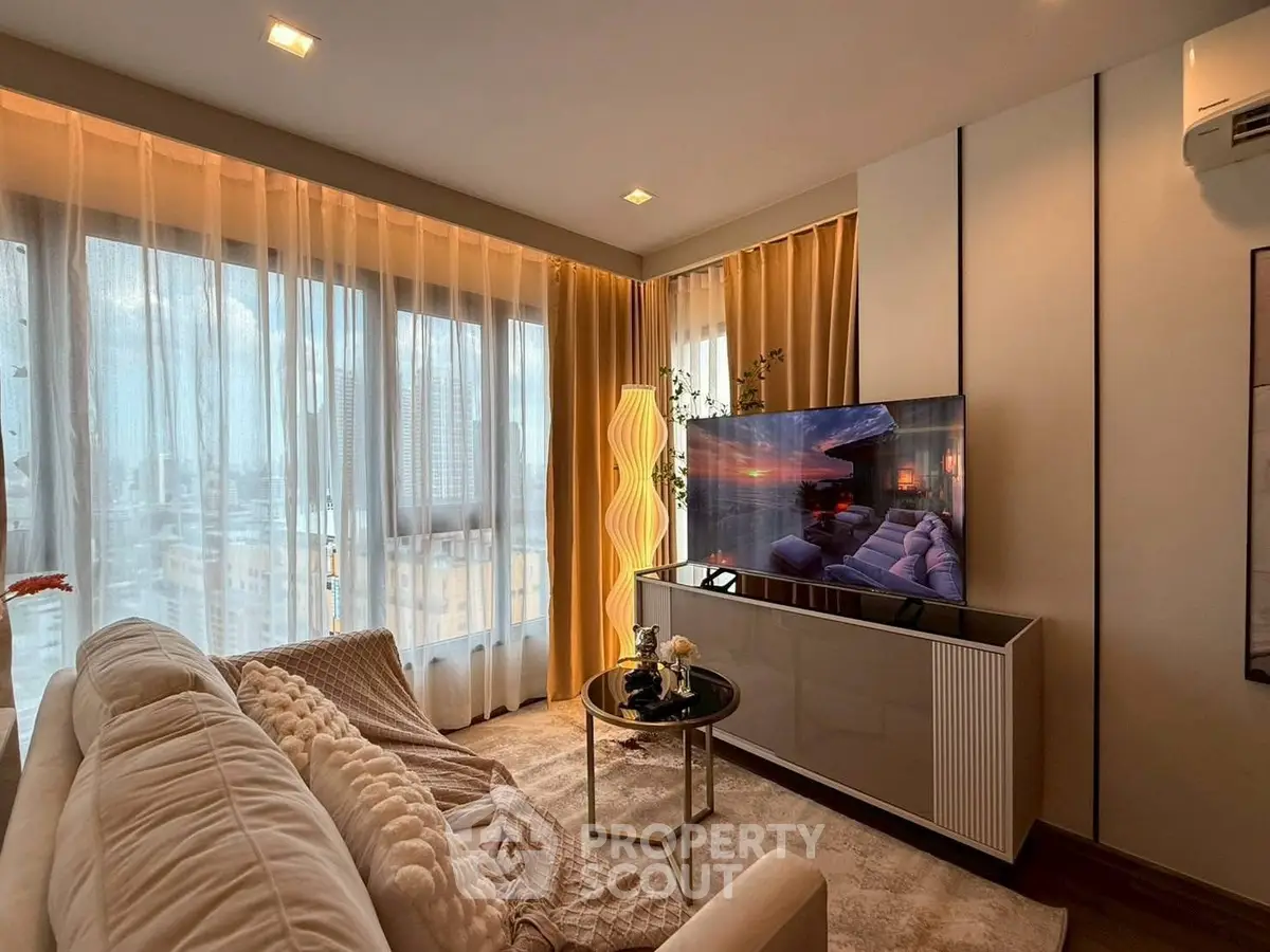 Luxurious living room with panoramic city view, modern decor, and cozy ambiance.