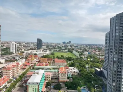 Stunning cityscape view from high-rise building showcasing urban landscape and greenery