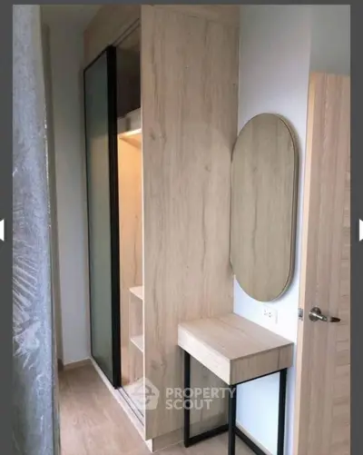 Stylish modern bedroom corner with wooden wardrobe and vanity mirror