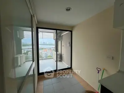 Bright apartment with balcony offering stunning cityscape views and ample natural light.