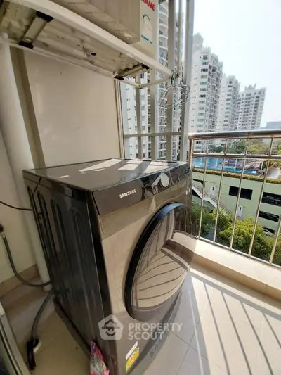 Modern balcony with Samsung washing machine and city view