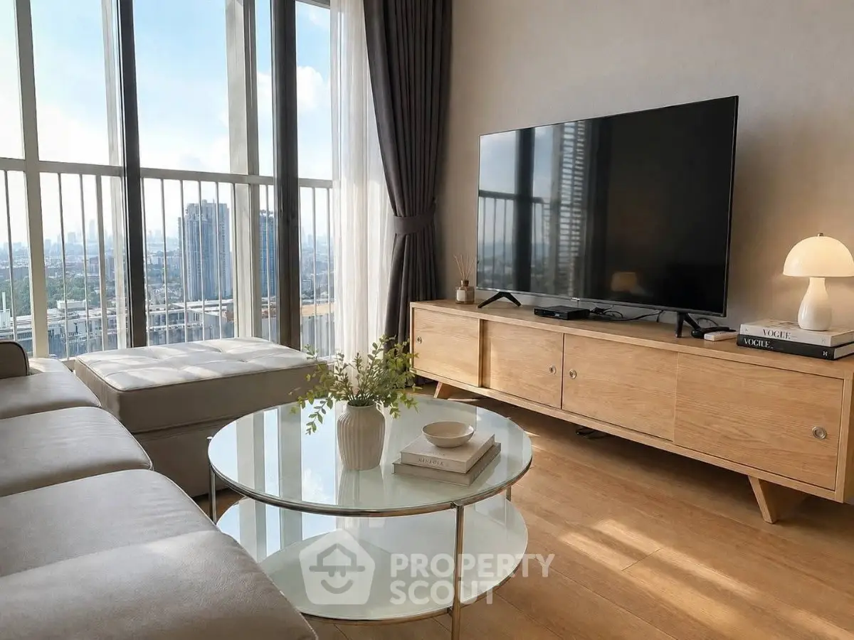 Modern living room with large windows, stylish furniture, and stunning city view.