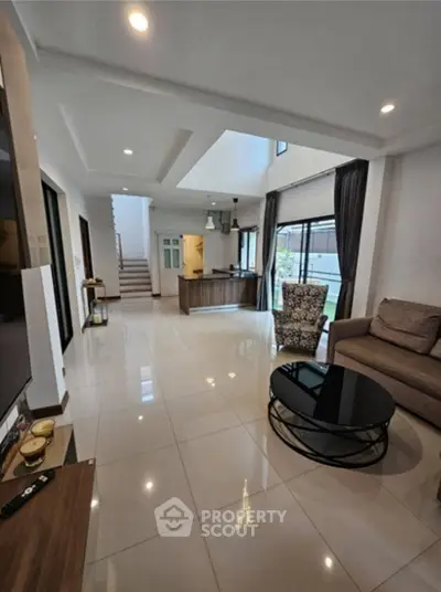 Spacious modern living room with open layout and stylish furniture