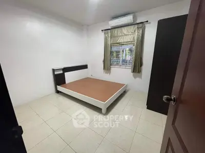 Spacious bedroom with minimalist design and natural light