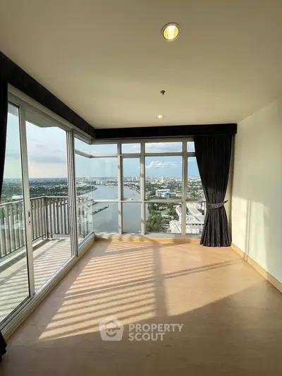 Spacious corner unit with stunning river view and large balcony in modern apartment.
