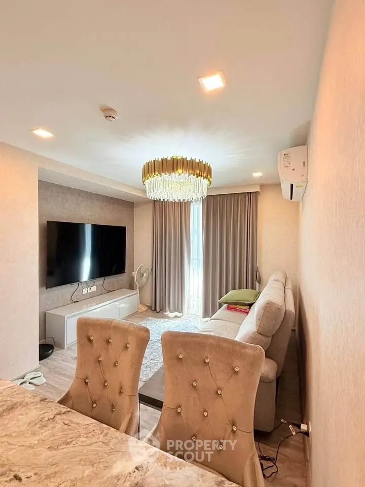 Luxurious living room with elegant chandelier and modern decor