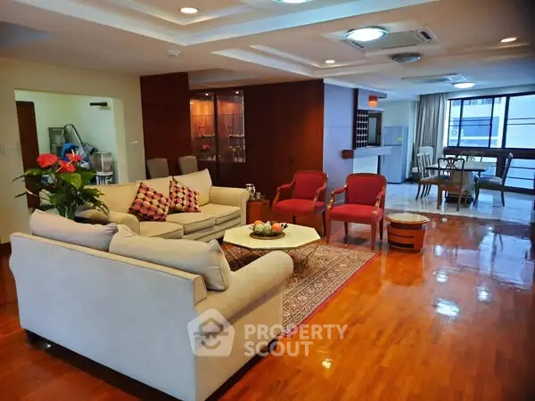 Spacious living room with elegant decor and wooden flooring in modern apartment