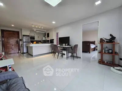 Spacious open-plan living room with modern kitchen and dining area