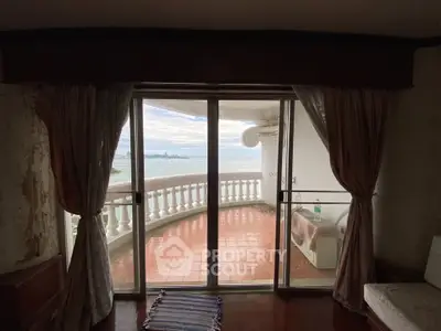 Spacious balcony with stunning ocean view and elegant railing, perfect for relaxation.