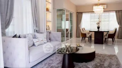 Luxurious living and dining area with elegant decor and ample natural light.