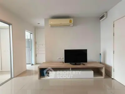 Modern living room with minimalist decor and air conditioning unit