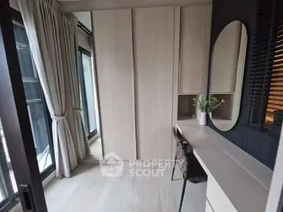 Modern study room with sleek desk, mirror, and large windows for natural light