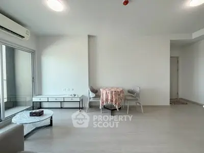 Spacious modern living room with minimalist decor and natural light