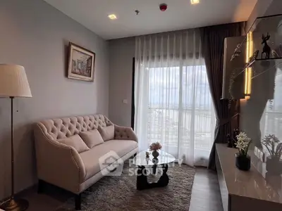 Elegant living room with plush sofa and panoramic window view