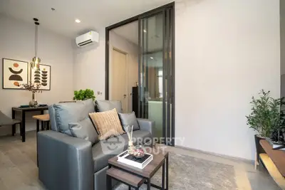 Modern living room with sleek furniture and stylish decor in a contemporary apartment.