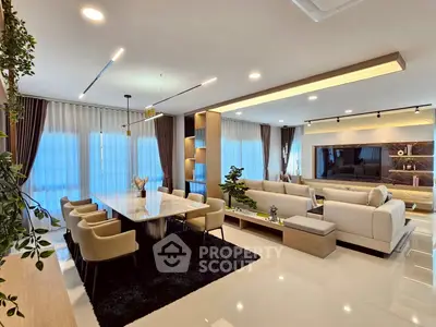 Luxurious open-plan living room with elegant dining area and modern decor