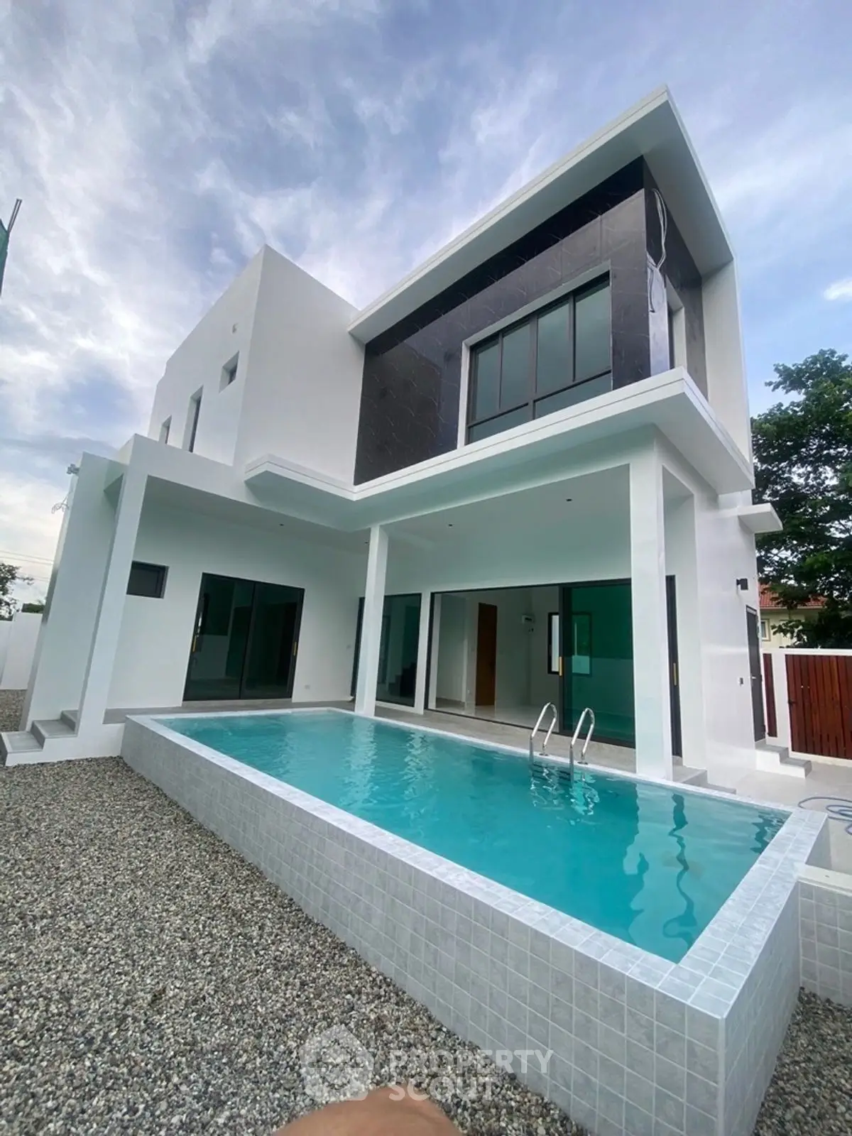 Modern two-story house with sleek design and private swimming pool