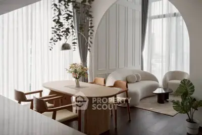 Elegant modern living room with stylish furniture and large windows, perfect for contemporary urban living.