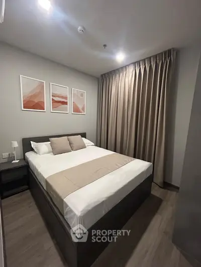 Modern bedroom with stylish decor and cozy ambiance in a contemporary apartment.