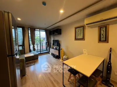 Modern living room with balcony view and stylish decor in urban apartment