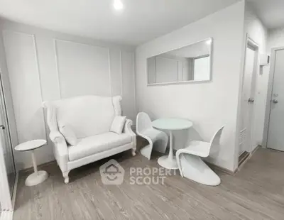 Modern minimalist living room with white furniture and sleek design