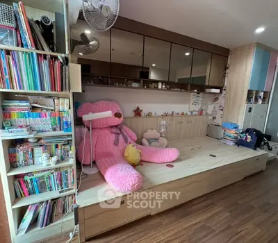 Cozy children's bedroom with built-in storage and playful decor