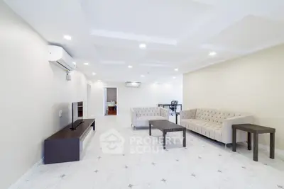 Spacious modern living room with elegant furniture and bright lighting