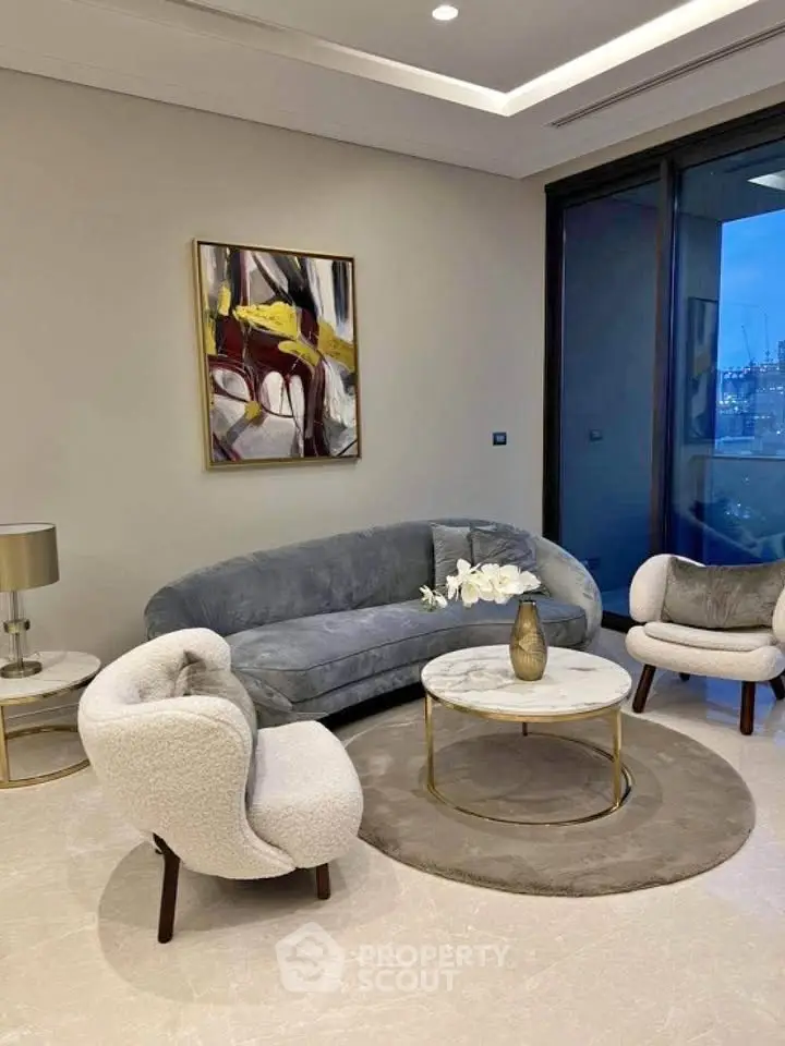 Elegant living room with modern furniture and large window offering stunning city view.