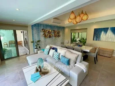 Luxurious open-plan living room with stylish decor and elegant dining area, perfect for modern living.