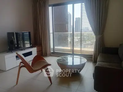 Modern living room with city view, stylish furniture, and large windows for natural light.