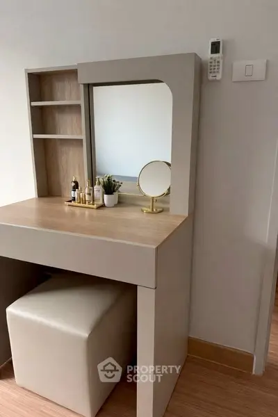 Modern vanity table with mirror and storage in a stylish bedroom setting.