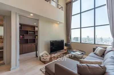 Spacious modern living room with large windows and city view
