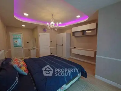 Luxurious bedroom with modern lighting and elegant decor