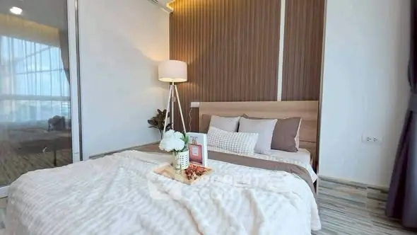 Cozy modern bedroom with stylish decor and natural light
