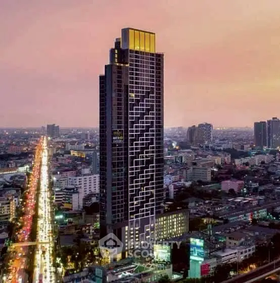 Stunning cityscape view featuring a modern high-rise building at sunset, perfect for urban living.