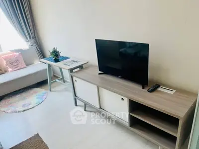 Cozy living room with modern TV stand and natural light