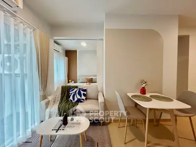 Modern living room with cozy dining area and stylish decor