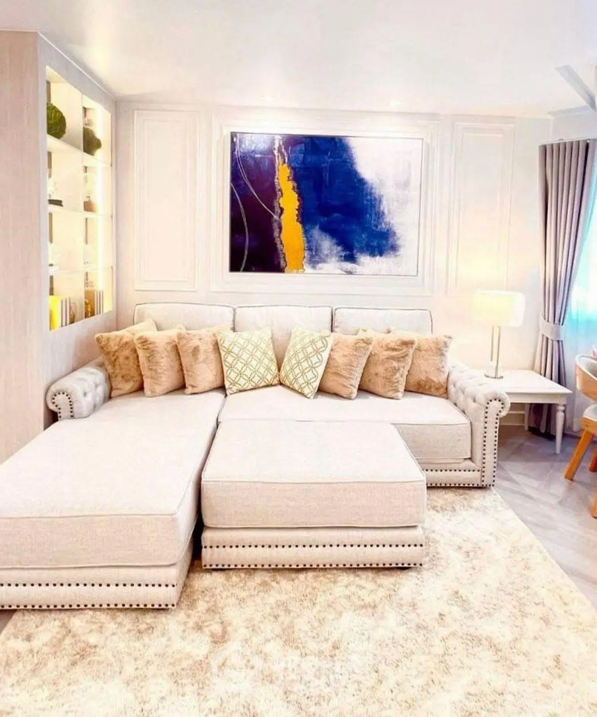 Luxurious living room with plush sectional sofa and modern art decor