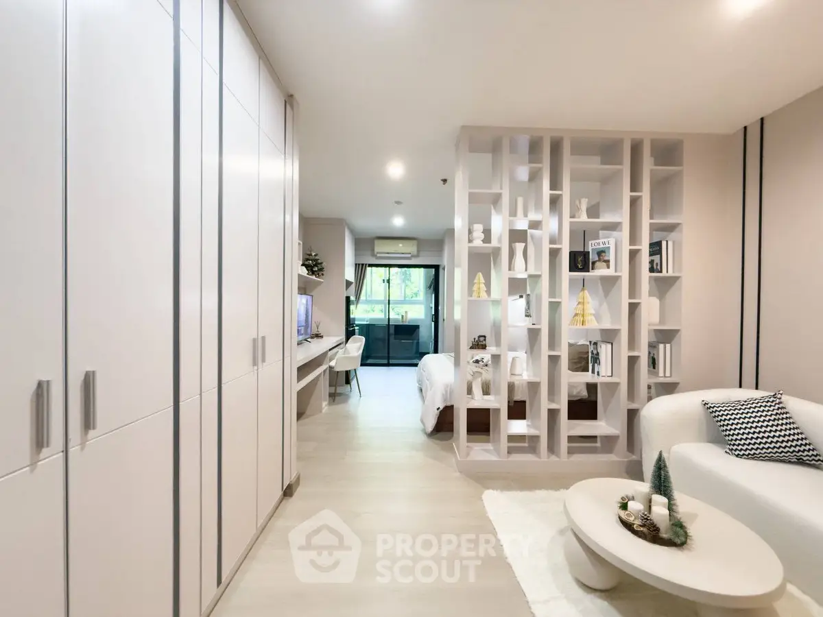 Modern open-plan living room with stylish decor and ample natural light