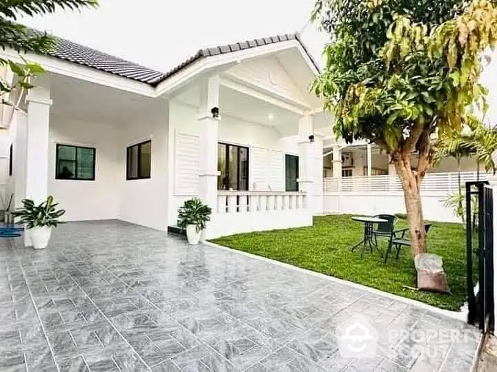 Charming single-story home with spacious garden and tiled driveway