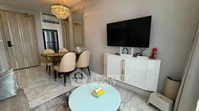 Modern living room with elegant dining area and wall-mounted TV