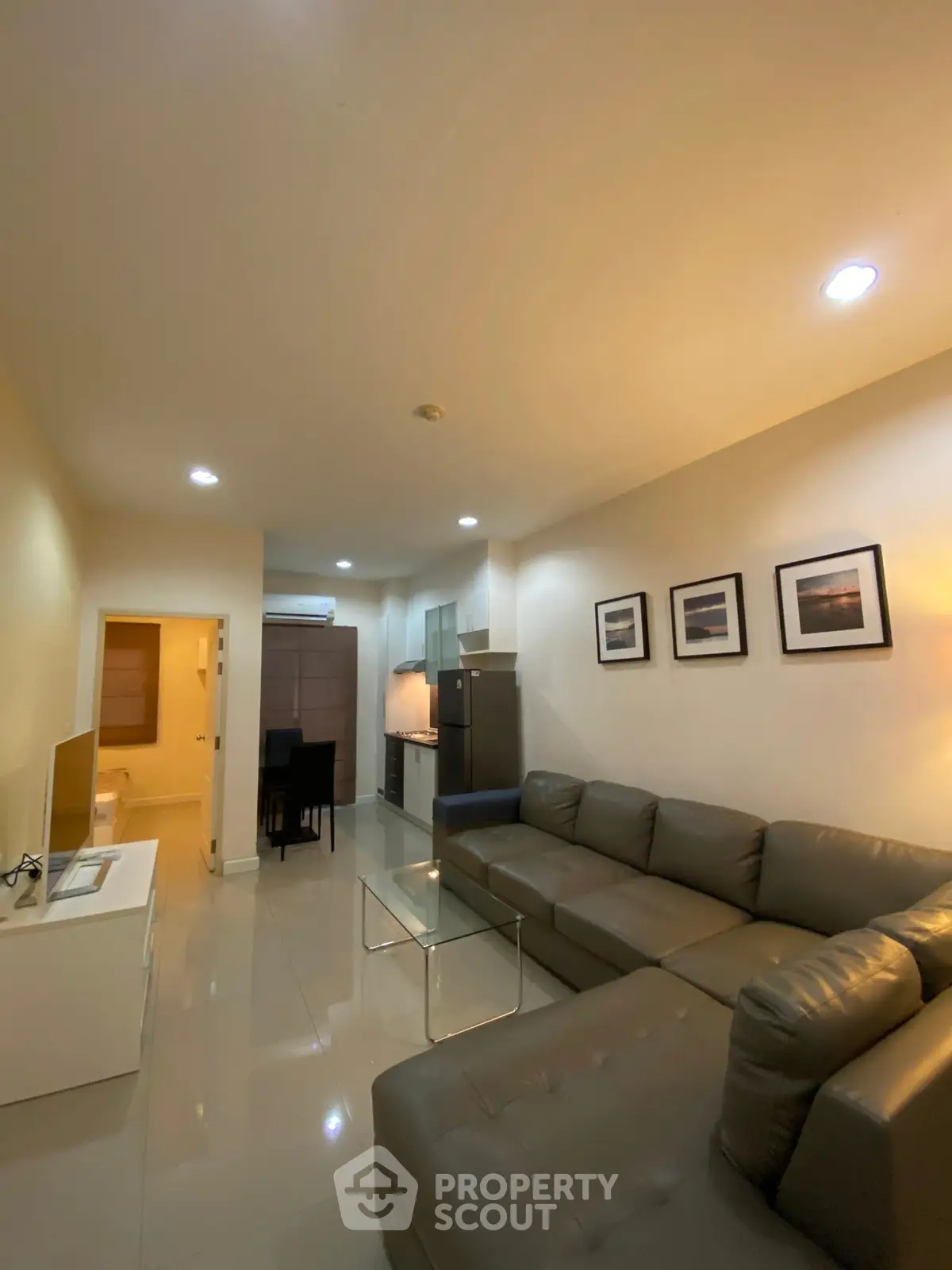 Modern living room with sleek furniture and stylish decor in a cozy apartment setting.