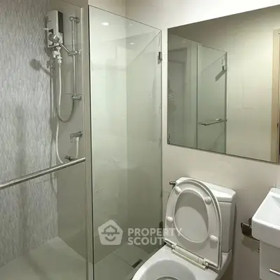 Modern bathroom with glass shower and sleek fixtures