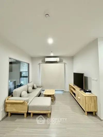 Modern living room with sleek furniture and neutral tones