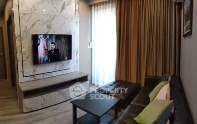 Modern living room with marble accent wall and mounted TV, featuring stylish furniture and elegant curtains.